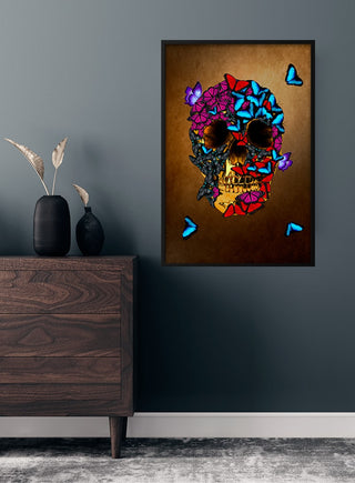 Golden skull with colorful butterflies poster hanging on a dark wall above a wooden dresser.