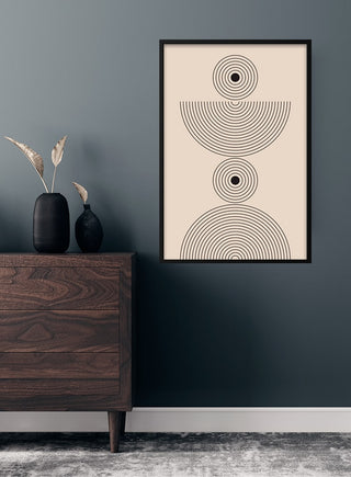 Minimalist poster with black concentric half-circles, framed and hung on a dark green living room wall.
