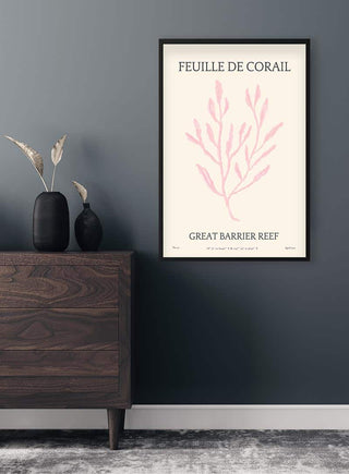 Feuille De Corail No. 01 art poster with pink coral illustration, framed and hanging on a dark wall above a dresser.