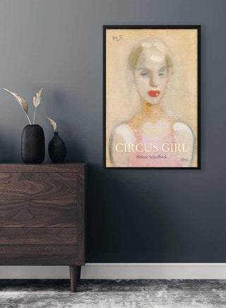 Framed Circus Girl - Helene Schjerfbeck, 1916 art print hanging on a dark wall above a wooden dresser.