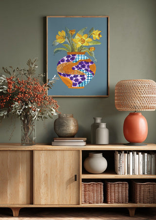 Narcissus by Marjorie Salvagni above a wooden sideboard on a sage green wall
