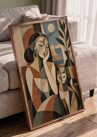 Geometric Woman & Cat – Earthy Cubist Harmony by TimlessArtworks in a walnut frame leaning against a grey sofa