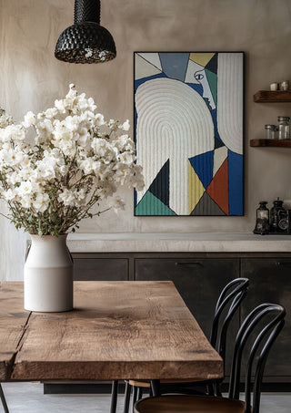 Ossacip by Art Guveau in a black frame above a rustic table with white flowers