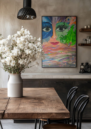 Face Above Pastel Waters by Camilla Sabrina in a black frame above a rustic table with white flowers