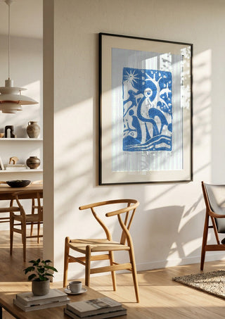 Schnitt durch den Hain · Cut Through the Grove by ELIZA Leopold in a black frame in a bright dining room with wooden chairs