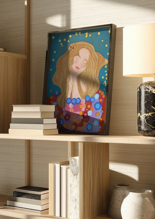 The dreamer by Gerard Ceulemans in a dark frame on a wooden shelf beside books and a lamp