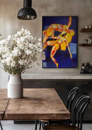 Two Figures in Blue by René J in a black frame above a rustic table with white flowers