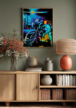 Bike Boys by Pelecan Schneider above a wooden sideboard on a sage green wall