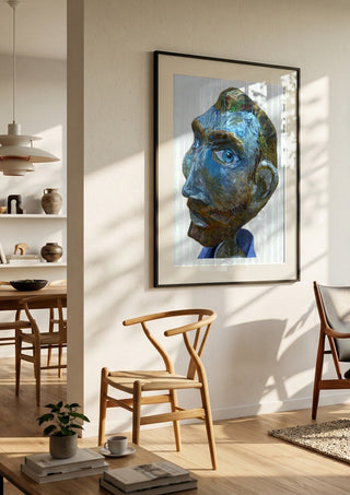 Vincent by Simone Hübner-Schwinn in a black frame in a bright dining room with wooden chairs