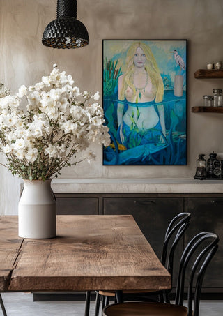 Die Tochter des Wassermann by Andreas Pohle in a black frame above a rustic table with white flowers