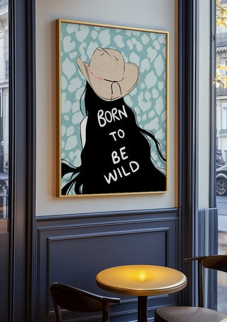 Born to be wild by Lisen Vennesland in an oak frame on a panelled café wall