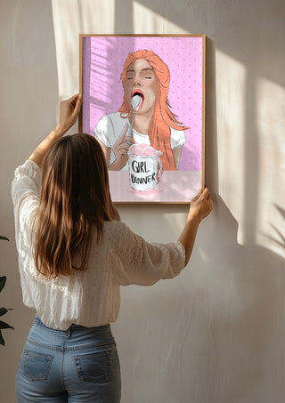 Girl Dinner by Lisen Vennesland being hung on a sunlit wall