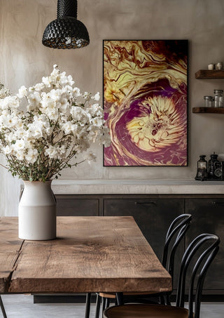 Plum Bloom by Da Winters in a black frame above a rustic table with white flowers