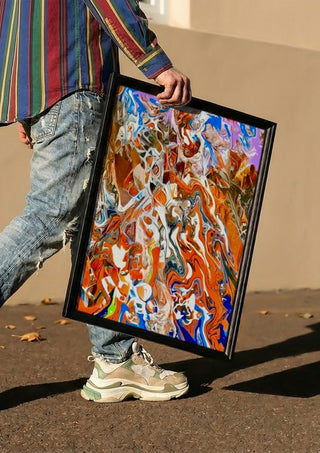 Ember Current by Da Winters carried in a black frame along a sunny street