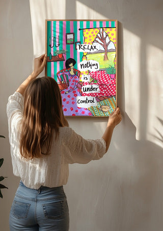 Nothing Is Under Control by Camilla Nilsson being hung on a sunlit wall