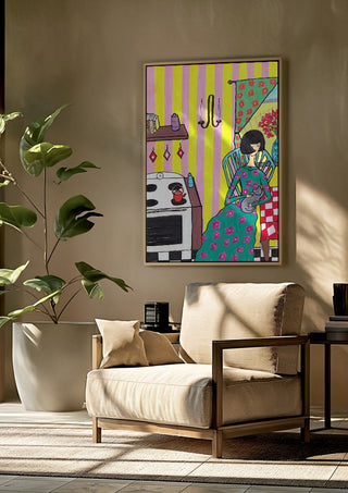 Afternoon with the Cat by Camilla Nilsson framed above a beige armchair beside a potted plant