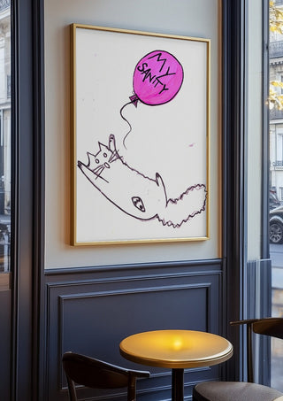 My Sanity by Camilla Nilsson in an oak frame on a panelled cafe wall