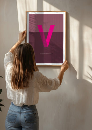 V as in Va-va-voom – Cerise by Quite Nice Prints being hung on a sunlit wall