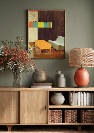 White Sofa by Kareem Rizk above a wooden sideboard on a sage green wall