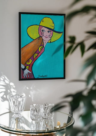 Frau mit Hut by Trude in a black frame above a glass table with crystal glassware