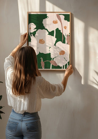Abstract Flowers 9 by ThingDesign being hung on a sunlit wall