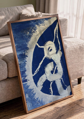 Fragility by Linor Citaku in a walnut frame leaning against a grey sofa