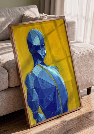 Blue figure / yellow field by Linor Citaku in a walnut frame leaning against a grey sofa