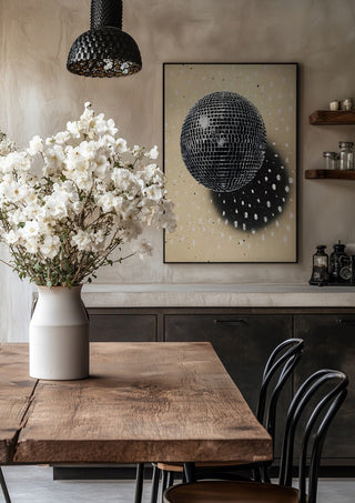 Disco Star by Carl Smith ART in a black frame above a rustic table with white flowers