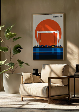 Malmö 74 by Bo Lundberg framed above a beige armchair beside a potted plant