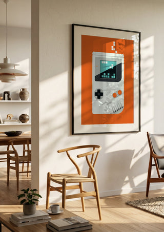 Playing games by Bo Lundberg in a black frame in a bright dining room with wooden chairs