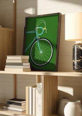 Italian Racing Bike - Detail by Bo Lundberg in a dark frame on a wooden shelf beside books and a lamp