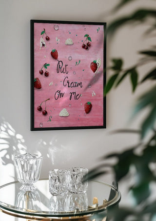 Put Cream On Me by KG Studio in a black frame above a glass table with crystal glassware