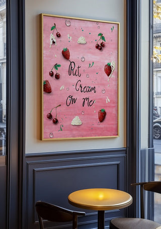 Put Cream On Me by KG Studio in an oak frame on a panelled cafe wall