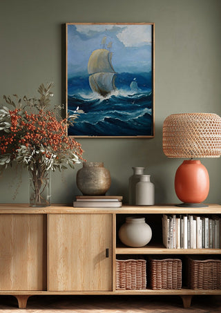 Full Sail by Justyna Kopania above a wooden sideboard on a sage green wall