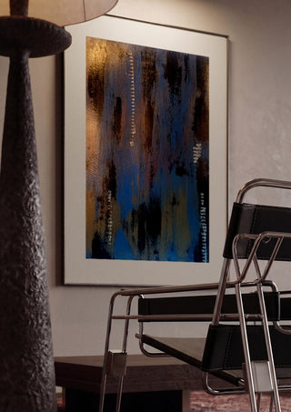 Script in Blue and Copper by Kristof ellertz framed in a dim room beside a tubular steel chair