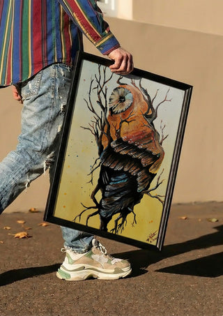 Between worlds by Lüba carried in a black frame along a sunny street