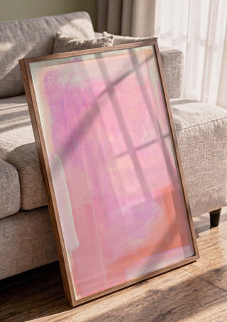 soft atmospheric colorfields by Iris Lehnhardt in a walnut frame leaning against a grey sofa