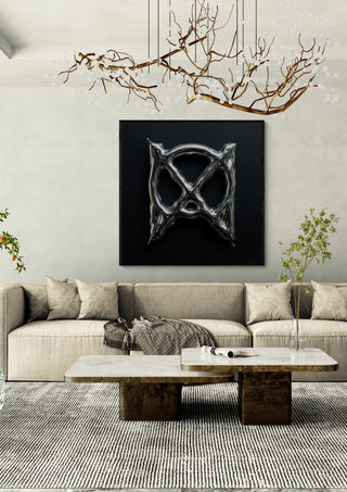Liquid Chrome by Kristof ellertz in a black frame above a beige sofa under a branch chandelier