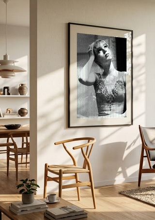 The Russian ballet dancer by Bettinafloorphoto in a large black frame in a bright dining room