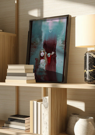 Edge of darkness by Bettinafloorphoto in a dark frame on a wooden shelf beside books and a lamp