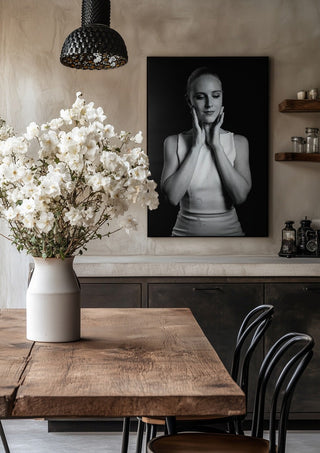 Quiet Light by Bettinafloorphoto in a black frame above a rustic table with white flowers