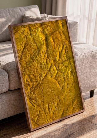 Das Licht in uns by Sophie Schillen in a walnut frame leaning against a grey sofa