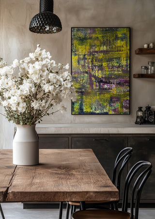 Sonnenschein by Sophie Schillen in a black frame above a rustic table with white flowers