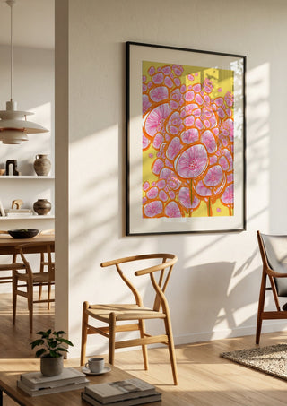 The happy meadow by Creationsbyeditabrus in a black frame in a bright dining room with wooden chairs