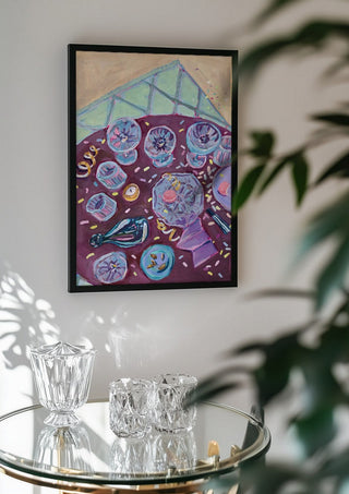 Dagen der på by DNF in a black frame above a glass table with crystal glassware