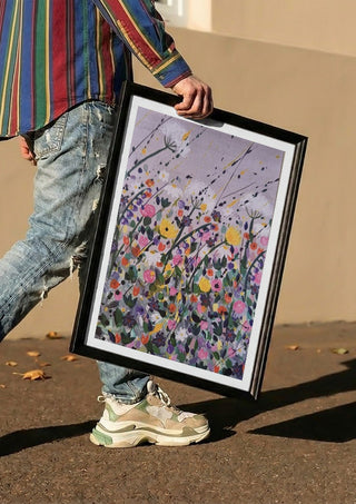 Silver street by Rebecca Wright carried in a black frame along a sunny street