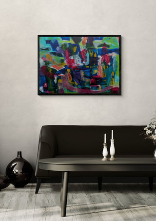 Melange by Janet Bell in a black frame on a pale wall above a dark sofa with candlesticks