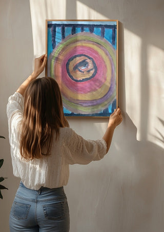 Zeebodem by Mizo being hung on a sunlit wall