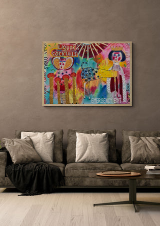 La noche confunde by María Burgaz in a light oak frame on a warm grey wall above a brown sofa