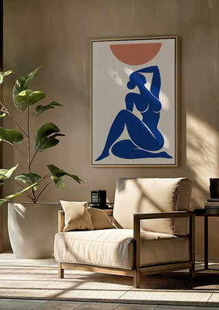 Abstract Nude Art Inspired by Henri Matisse by TimlessArtworks framed above a beige armchair beside a potted plant